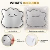 06-smile-mirror-whats-included Smile blob acrylic mirror with front protective film, self-adhesive backing and protective bubble pouch; two views of one mirror.
